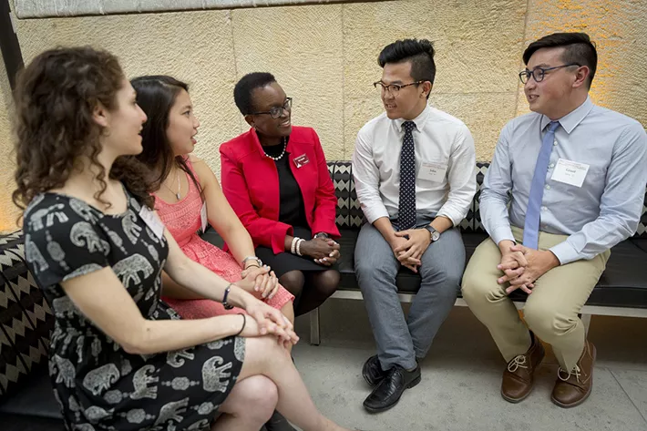President Smith talking with students and alums