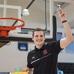 Shane Loeffler cuts off nets after winning conference title